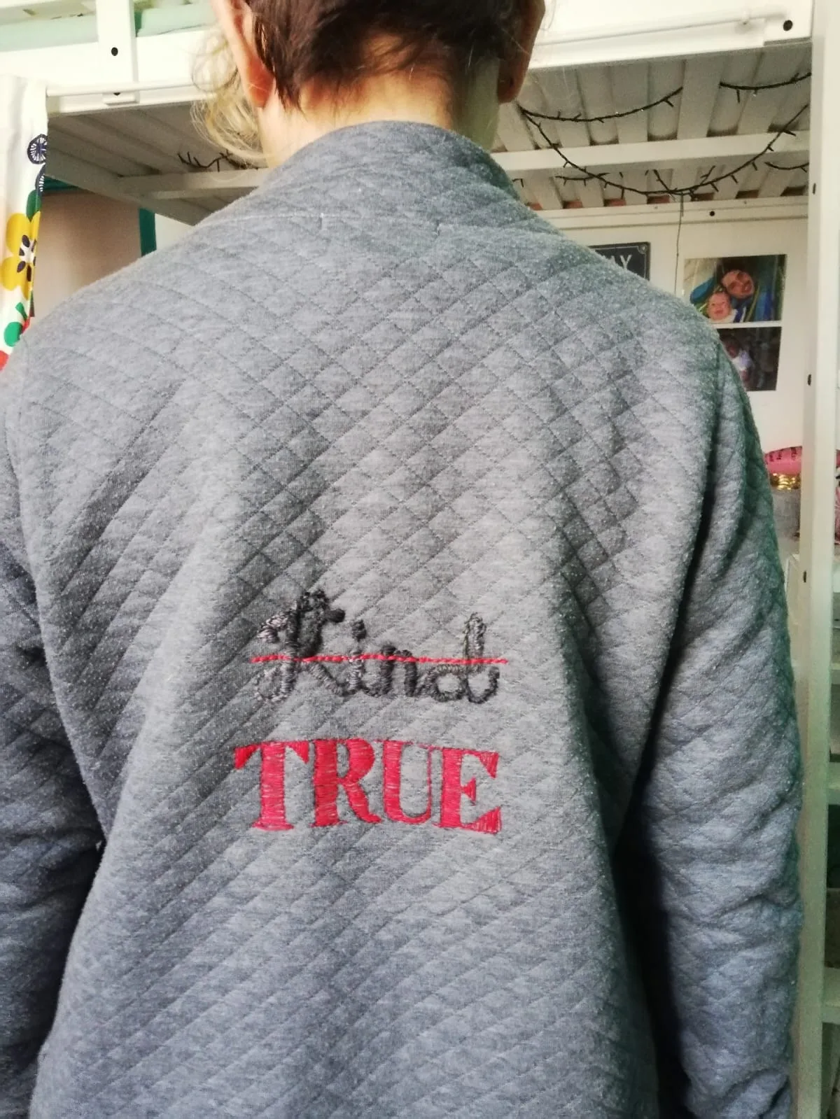True, not kind · Red and black cotton thread embroidered on a second-hand grey hoodie - size S/M